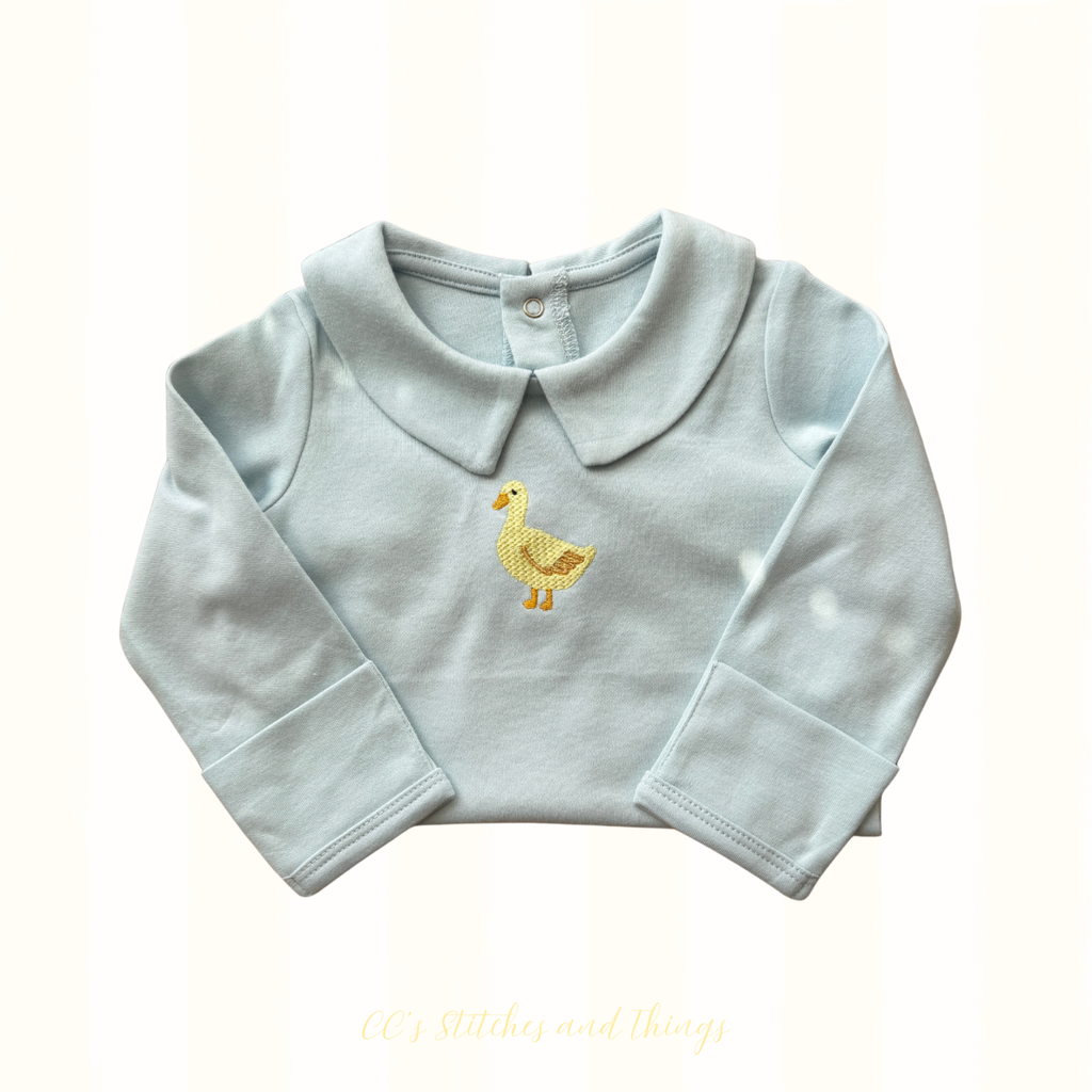 Duck Embroidery Design stitched on a baby onesie