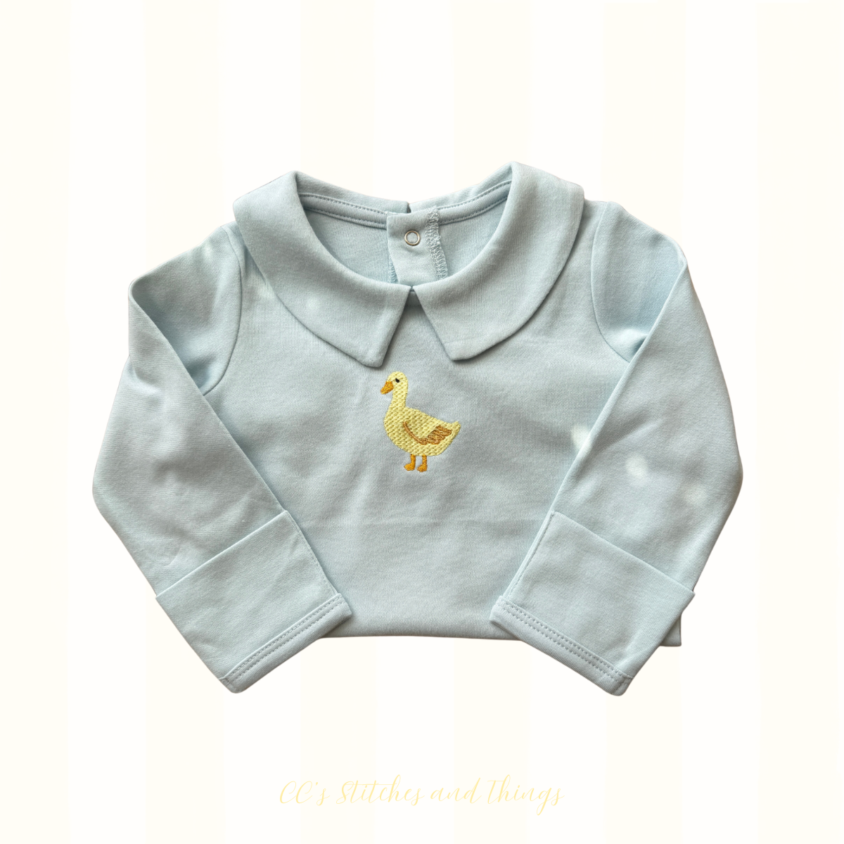 Duck Embroidery Design stitched on a baby onesie